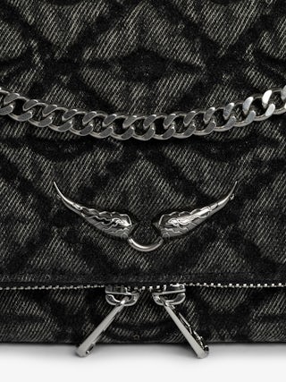 Rock II Monogram Clutch - Clutch in denim with sliding metal chain and signature wings.