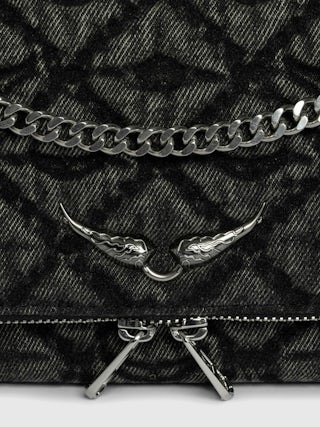 Rock II Monogram Clutch - Clutch in denim with sliding metal chain and signature wings.