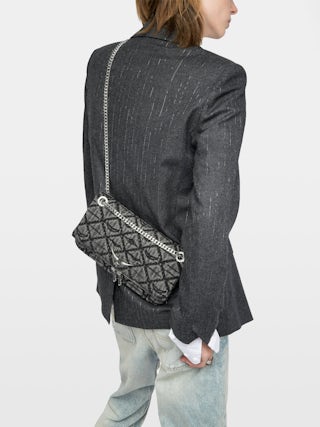 Rock II Monogram Clutch - Clutch in denim with sliding metal chain and signature wings.