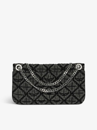 Rock II Monogram Clutch - Clutch in denim with sliding metal chain and signature wings.