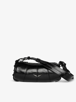 Le Roudoudou Vintage Patent Bag - Patent leather bag with vintage-inspired effect, adjustable shoulder strap and wings signature.