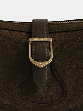 Moonrise Bag - Baguette bag in suede with leather handle and signature wings.