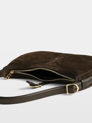 Moonrise Bag - Baguette bag in suede with leather handle and signature wings.