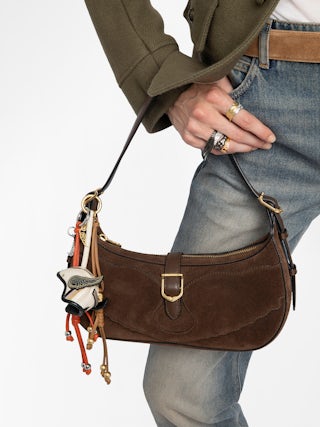 Moonrise Bag - Baguette bag in suede with leather handle and signature wings.