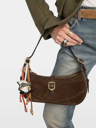 Moonrise Bag - Baguette bag in suede with leather handle and signature wings.