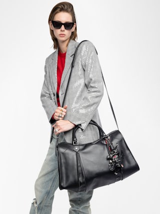 Sunny XL Bag - Zadig & Voltaire x EGONlab reimagine the iconic carryall in smooth black leather. Oversized and effortlessly cool, it’s made to hold everything you need and more, from workdays to weekends. Wear it by the handles or on the shoulder for versatile, everyday edge.