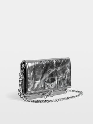 Rock Vintage Metal Clutch - Metallic leather clutch with double leather and metal chains and rhinestone-embellished wings.