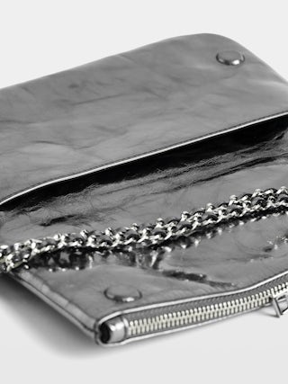Rock Vintage Metal Clutch - Metallic leather clutch with double leather and metal chains and rhinestone-embellished wings.