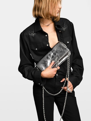 Rock Vintage Metal Clutch - Metallic leather clutch with double leather and metal chains and rhinestone-embellished wings.