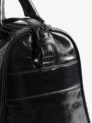 Sac Sunny Medium Vibe Studs - Sac en cuir vernis effet vintage à clous, bandoulière ajustable et anses avec signature ailes en métal.