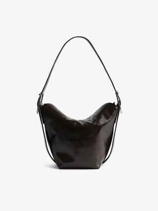 Baby Jane Vintage Patent Bag - Vintage-effect patent leather bag with adjustable shoulder strap and embossed wings signature.