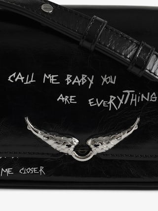 Le Zazi Vintage Graffiti Bag - Small patent leather bag with vintage effect and graffiti print, with adjustable strap and signature wings.