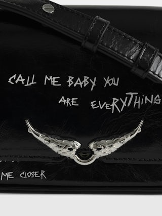 Le Zazi Vintage Graffiti Bag - Small patent leather bag with vintage effect and graffiti print, with adjustable strap and signature wings.