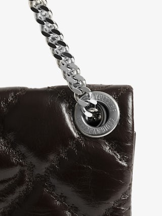 Rock II Vintage Monogram Clutch - Clutch in vintage quilted effect leather with sliding metal chain and signature wings.