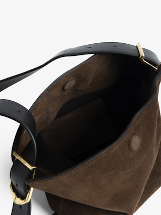 Baby Jane Suede Bag - Suede bag with adjustable shoulder strap and embossed wings signature.