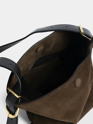 Borsa Baby Jane Suede - Borsa in camoscio con tracolla regolabile e firma ali in rilievo.