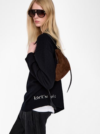 Baby Jane Suede Bag - Suede bag with adjustable shoulder strap and embossed wings signature.