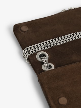 Rock II Suede Clutch - Suede leather clutch with sliding metal chain and signature wings.