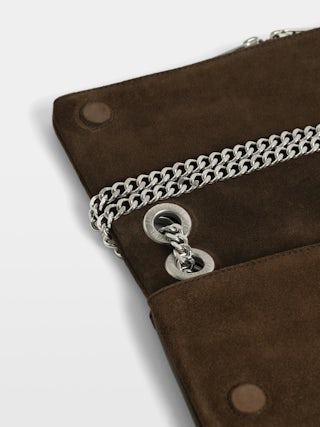 Rock II Suede Clutch - Suede leather clutch with sliding metal chain and signature wings.