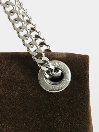 Rock II Suede Clutch - Suede leather clutch with sliding metal chain and signature wings.