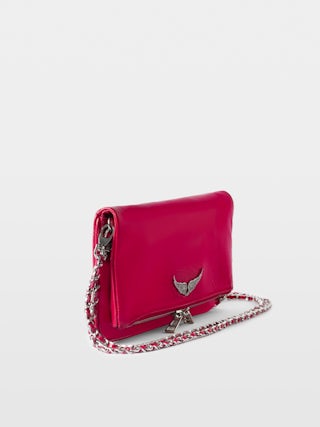 Clutch Rock Vintage Patent - Clutch in vintage-effect patent leather with two leather-and-metal chains and rhinestone wing signature.