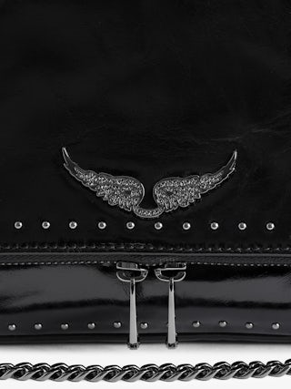 Sac Rocky II Vintage Patent Studs - Sac en cuir vernis effet vintage orné de clous à bandoulière, avec chaine et ailes signatures ornées de strass.