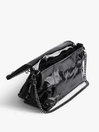 Sac Rocky II Vintage Patent Studs - Sac en cuir vernis effet vintage orné de clous à bandoulière, avec chaine et ailes signatures ornées de strass.