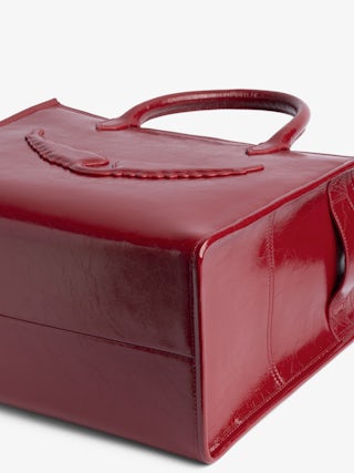 Sac Angel Tote XS - Petit sac en cuir froissé à doubles anses, bandoulière et signature ailes en relief.