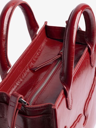 Sac Angel Tote XS - Petit sac en cuir froissé à doubles anses, bandoulière et signature ailes en relief.