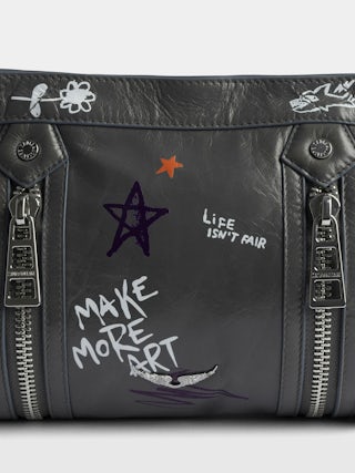 Sunny Moody Humberto Bag - Patent leather bag with vintage effect, with adjustable shoulder strap and wings signature and Humberto Cruz prints.