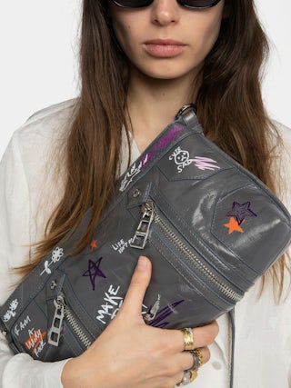 Sunny Moody Humberto Bag - Patent leather bag with vintage effect, with adjustable shoulder strap and wings signature and Humberto Cruz prints.