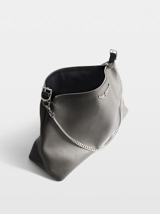 Borsa Jim - Borsa morbida in pelle martellata ornata con catena e ala con strass.