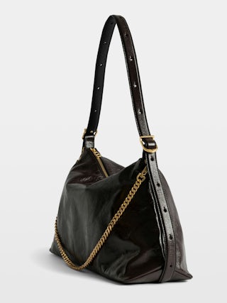 Jim Vintage Patent Bag - Soft leather bag with vintage effect adorned with a chain and a rhinestone wing.