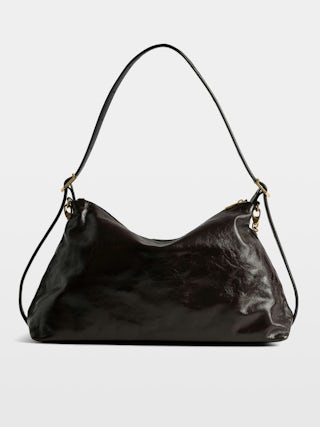 Jim Vintage Patent Bag - Soft leather bag with vintage effect adorned with a chain and a rhinestone wing.