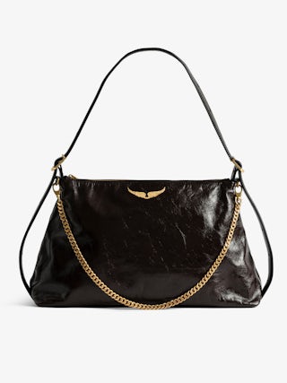 Jim Vintage Patent Bag - Soft leather bag with vintage effect adorned with a chain and a rhinestone wing.