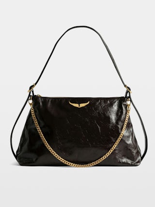 Jim Vintage Patent Bag - Soft leather bag with vintage effect adorned with a chain and a rhinestone wing.