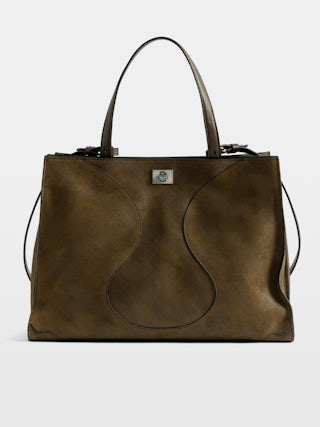 Jack Suede Bag - Suede leather bag with signature clasp, featuring two compartments, one handle and adjustable strap.