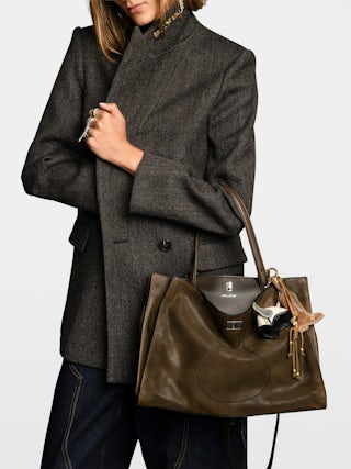 Jack Suede Bag - Suede leather bag with signature clasp, featuring two compartments, one handle and adjustable strap.