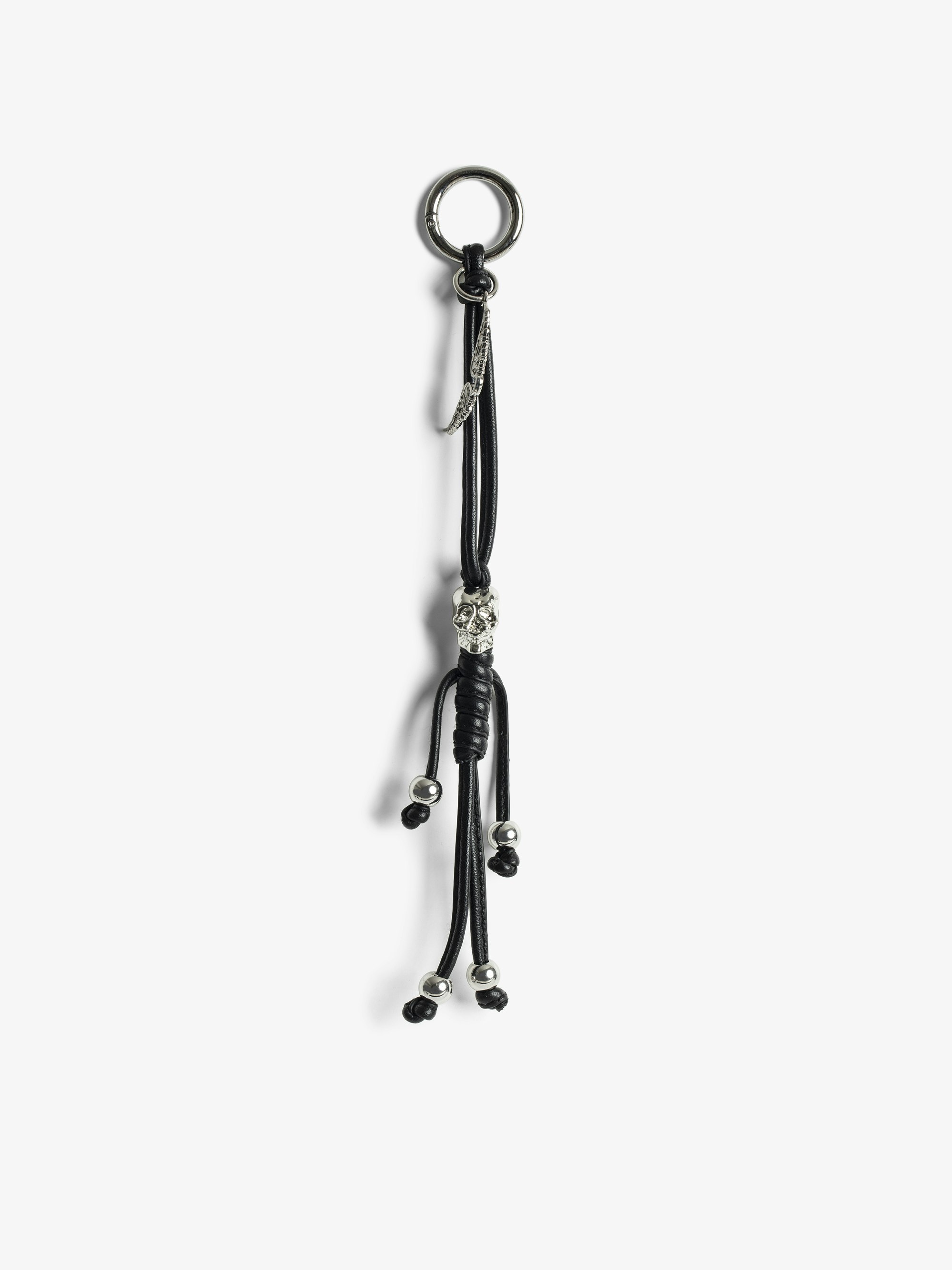 Charms Grigri Totenschädel - Grigri-Anhänger aus glattem Leder in Skelettform zum Anhängen an eine Tasche, zum Beispiel.