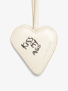 Flash Heart Keyring - Leather heart keychain with stripes and "Kiss My Ass" text on back.