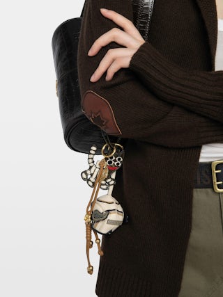 Ride Your Mind Keyring - Patent leather keychain with vintage-inspired effect, shaped like our iconic Ride Your Mind motorcycle helmet.