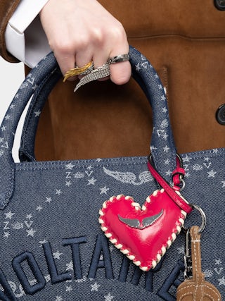 Porte-Clés Heart Tag - Grigri en cuir vintage, contour tressé et signature ailes.