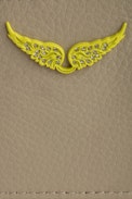 ZV Pass Card Holder - Women’s card holder in beige smooth leather with yellow wings.