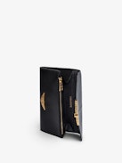 Borderline Wallet - Women’s wallet in shiny black leather with embossed iguana and black lacquered wings on the clasp