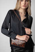 Borderline Leopard Clutch - Women’s brown patent leather leopard-print clutch with shoulder strap with wings charm.