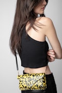 Borderline Leopard Clutch - Women’s patent yellow leather leopard-print clutch with shoulder strap with wings charm.