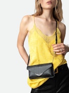 Borderline Embossed Clutch - Women’s black iguana-embossed leather clutch with shoulder strap with wings charm.