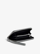 Compagnon Infinity Patent Wallet - Women’s silver glitter patent leather wallet with wristlet and wings charm.