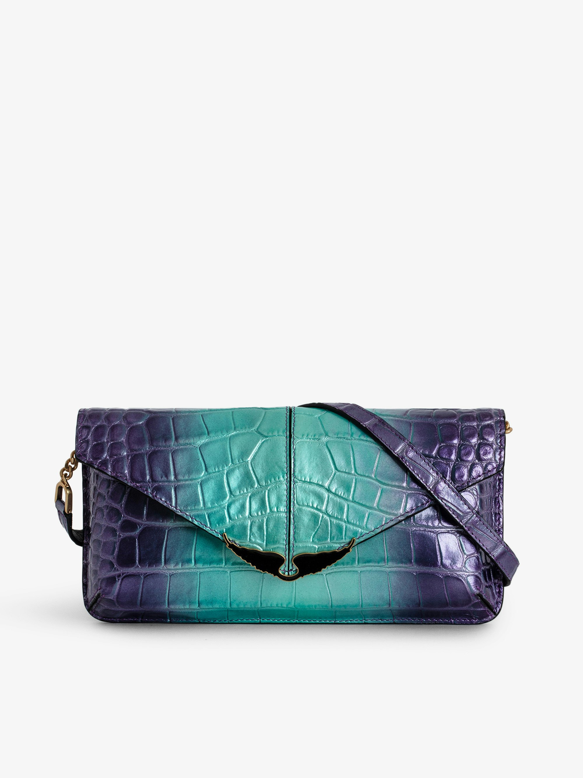 Borderline Embossed Metallic Clutch - Purple croc-embossed metallic leather clutch with leather shoulder strap and metal chain and lacquered wings.