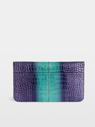 Borderline Embossed Metallic Clutch - Clutch in croc-effect embossed metallic leather with a lacquered wings clasp.